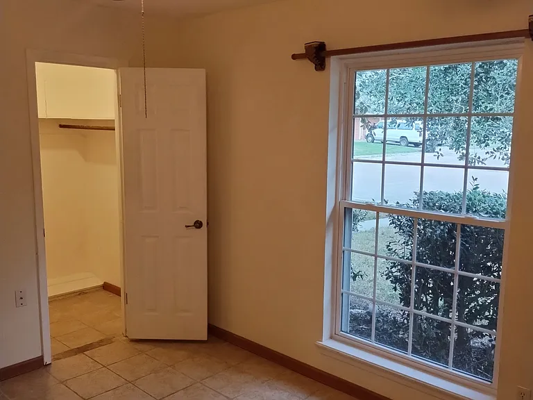 Front Bedroom with walk in closet door open.