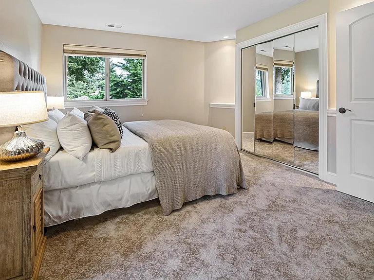Bedroom of 2 room suite - shows 1 of the two walk in closets - mirrored doors