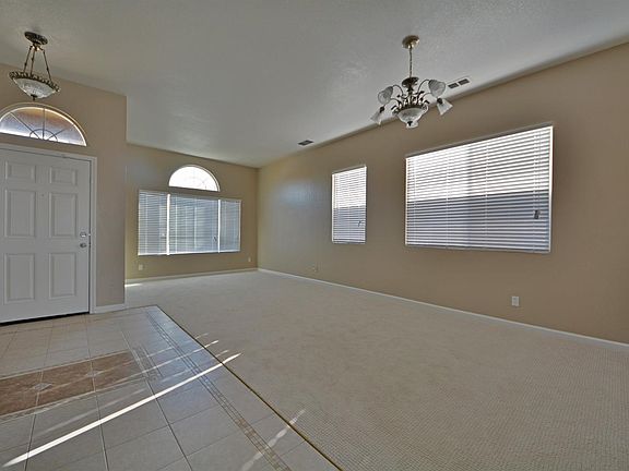 Living & dining room combination and lovely tiled entry with elegant design patterns.