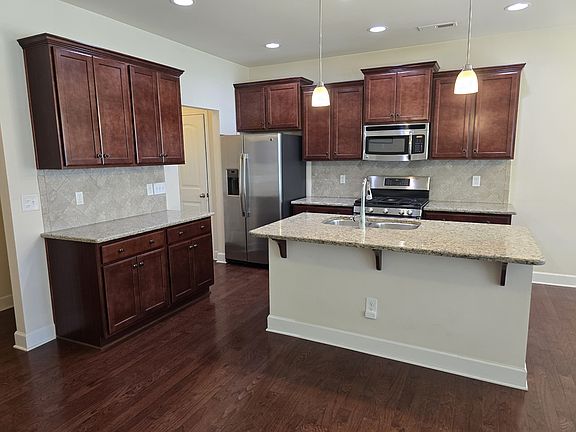 Kitchen with island for food prep and informal dining