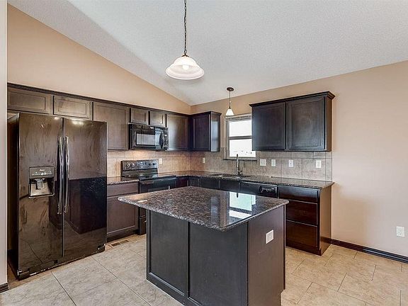 Large Kitchen, lots of cabinet space, refrigerator included
