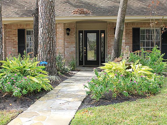 Professionally landscaped in front and back in 2012. Entire exterior of home was just painted. Swings and benches  to remain so you can enjoy your covered front porch. Keep all the plants looking nice and green with the sprinkler system.