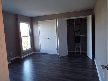 Large bedroom with his and hers custom closets