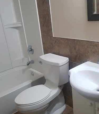 Updated Bathroom with Kohler Toilet and Tub/Shower UnitM