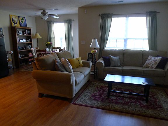 Floorplan open between kitchen, dining area, and living room