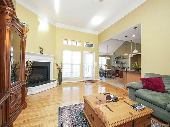 Wood flooring flows from foyer and dining room into great room