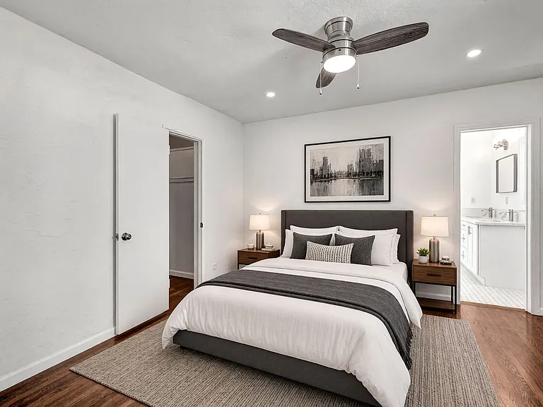 master bedroom with walk in closet and en suite bathroom