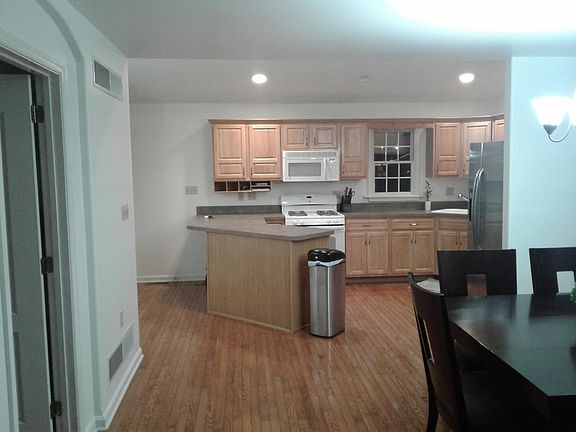 dining and kitchen open floor plan with half bath