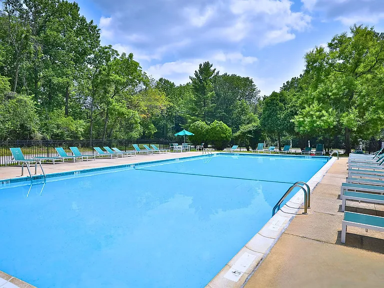 Dive into relaxation at The Woods at Ambler, an Eagle Rock Community. Unwind by the sparkling pool surrounded by lush greenery, the perfect spot for sunny days and refreshing swims. Schedule your visit today to see it all for yourself!