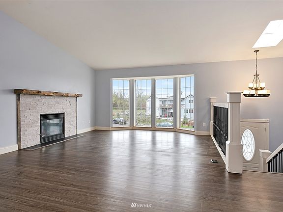 Large picture windows let loads of natural light into the living room.