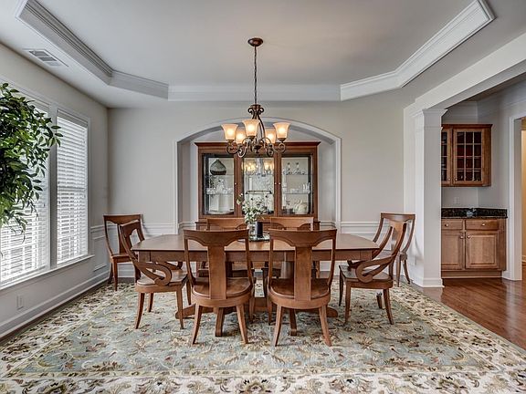 Beautiful dining room with trey ceiling.