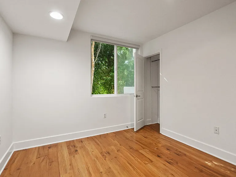 Bedroom with Recessed Lighting, Vinyl Flooring, and Windows