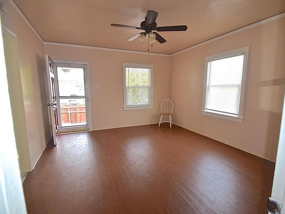 Living room looking from bedroom toward front door.