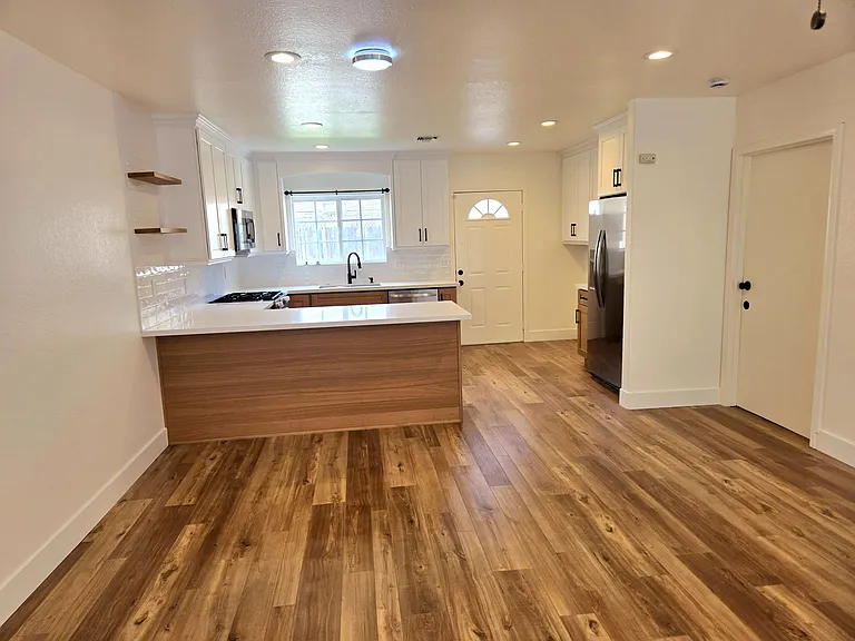 Completely remodeled kitchen with new cabinets, new countertops, new refrigerator, new stove / range, new microwave, new dishwasher, new sink, new faucet. Everything is NEW and Clean !