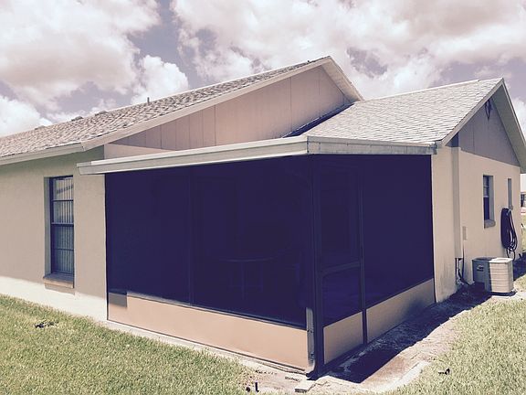 Back view of the house and screened lanai