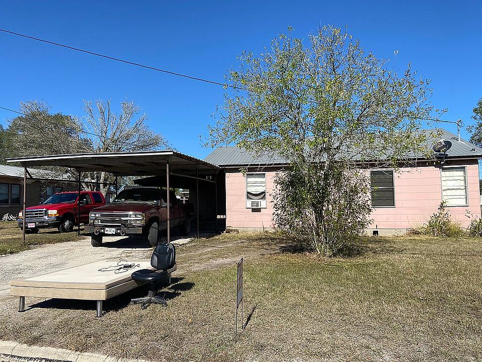 Front yard w/ carport