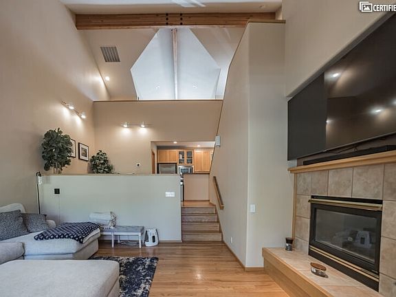 Stay cozy by the fireplace in this Bend Furnished Condo