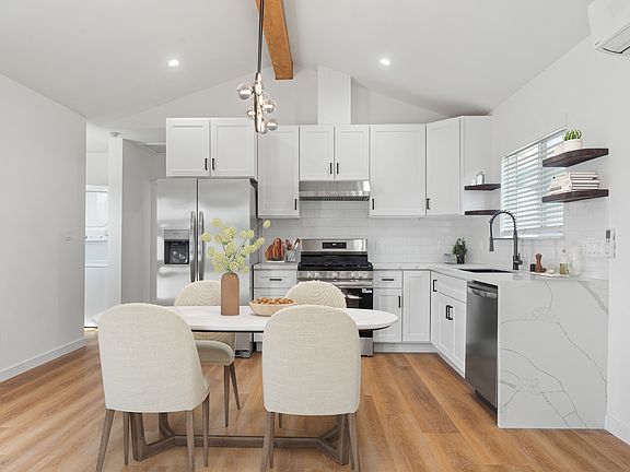 Virtually staged kitchen and dining area