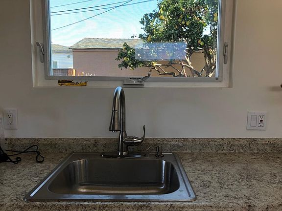 Always great to have a window above kitchen sink, the view is still my property (front house portion of yard). Again new sink and faucet. (no garbage disposal due to environmental concerts, however this unit has its own hot water heater.