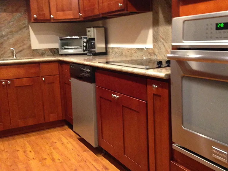 granite counter kitchen with stainless steel appliances. fully equipped with dishes/pots and pans etc.