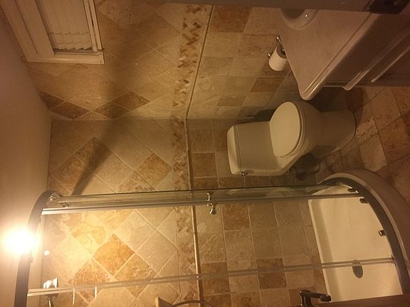 Gorgeous bathroom
						:
						Completely updated bathroom with travertine tiles and flooring. Stand up shower