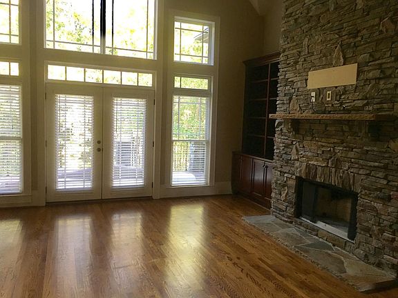 Vaulted ceiling in Family room with french doors to terrace
