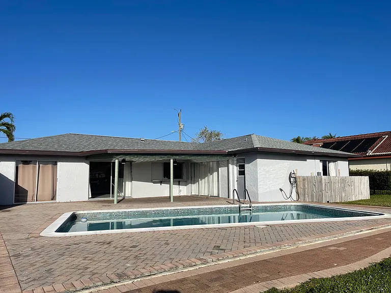 Swimming Pool and Rear Elevation