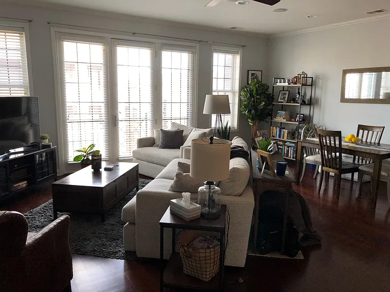 Living room, dining area in background