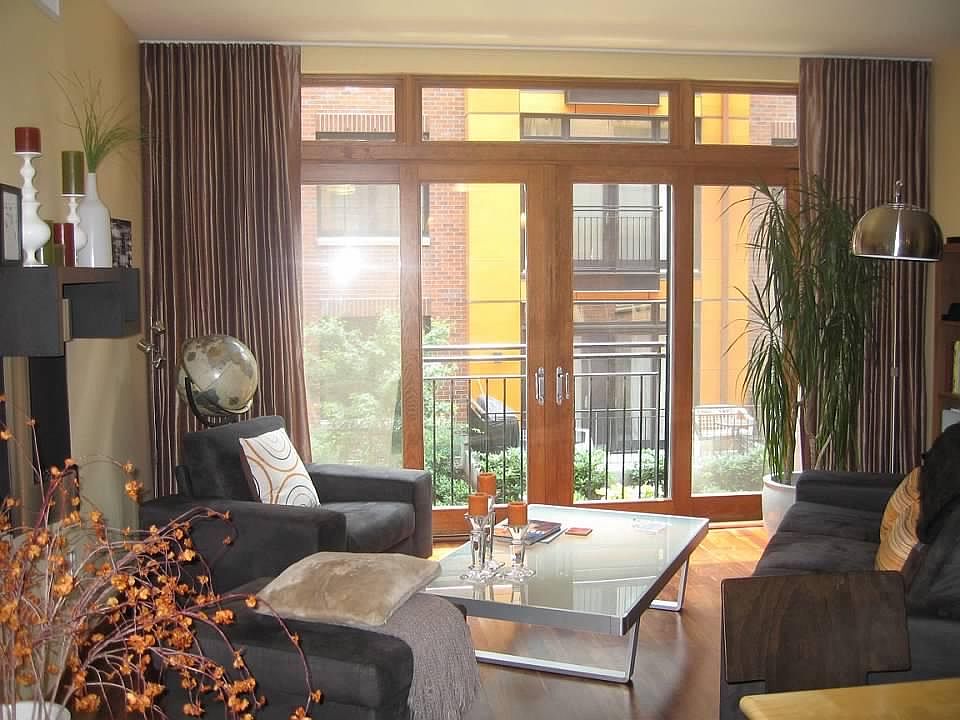 Living area with courtyard view and Juliet balcony