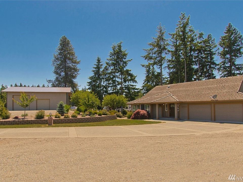 Estate style home on .956 acre with huge shop.