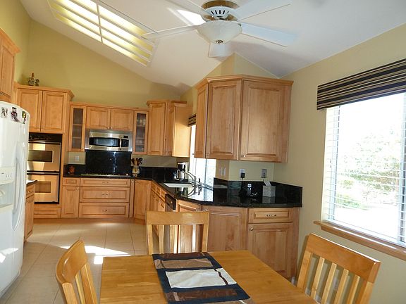 Maple cabinets, granite countertops, stainless appliances 