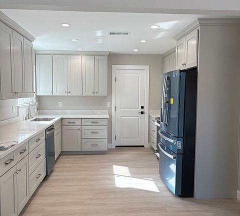 Kitchen with canister lighting, brand new cabinets, and appliances