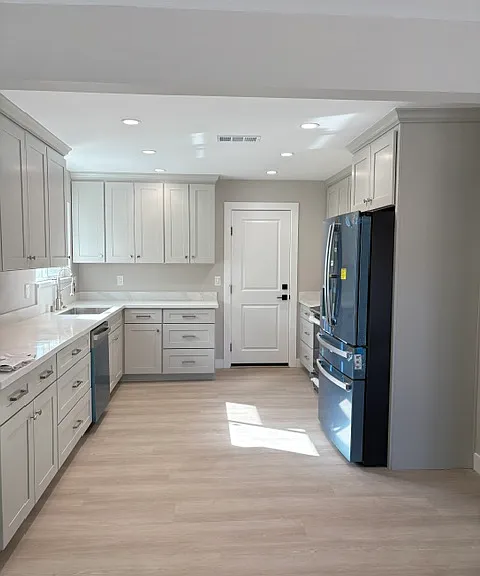 Kitchen with canister lighting, brand new cabinets, and appliances