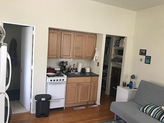 Hardwood flooring, stove, refrigerator; granite countertop