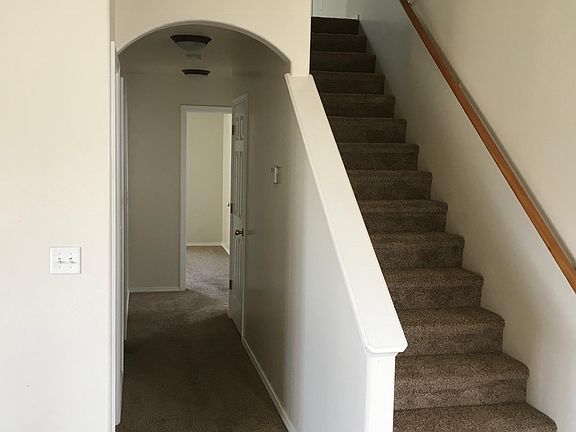 Stairwell to bonus area and 2 bedrooms. Hallway to master bedroom and main floor bedroom