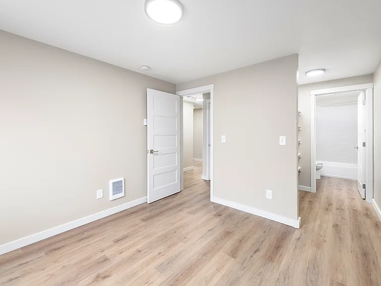 Renovated 2x2 primary bedroom with full bathroom & walk through closet. *no carpet options.