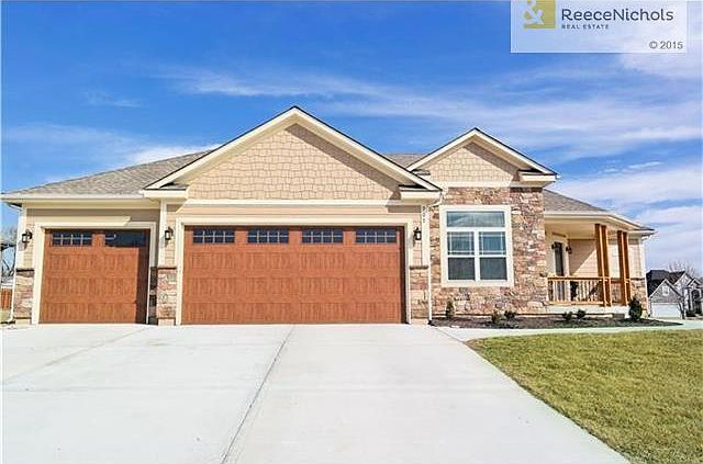 4 bedroom with enough room to add three additional conforming bedrooms in the lower level.  3 car garage.  Corner Lot.  The Raymore Recreational Park is right across the street with walking trails, pond, playground etc.,