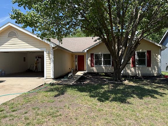 frontal view showing 2 car garage with opener