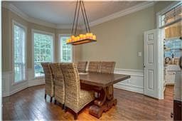 Entertain in style, dining room features new lighting, chair rail and wainscoting, elaborate crown m