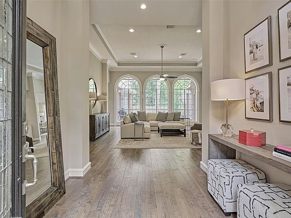 As you enter this stunning home you will see soaring ceilings and and all it has to offer! Gorgeous hardwood floors, updated neutral paint and decor with all recently added modern light fixtures! This home has the WOW factor everywhere!