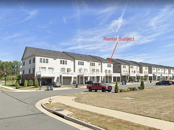 Subject - Rear View. Closet to additional parking spaces. Home is in walking distance to the community club-house and swimming pool.