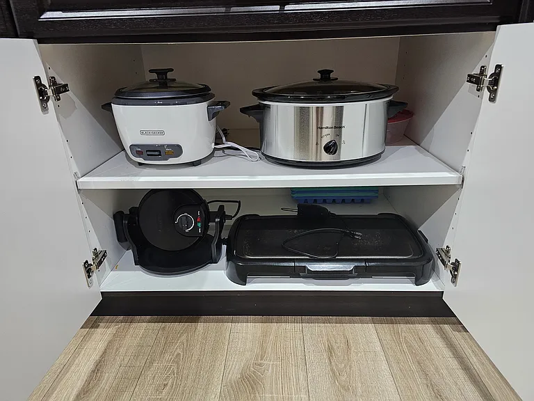 Appliances include: rice cooker, crock pot, waffle maker and skillet.