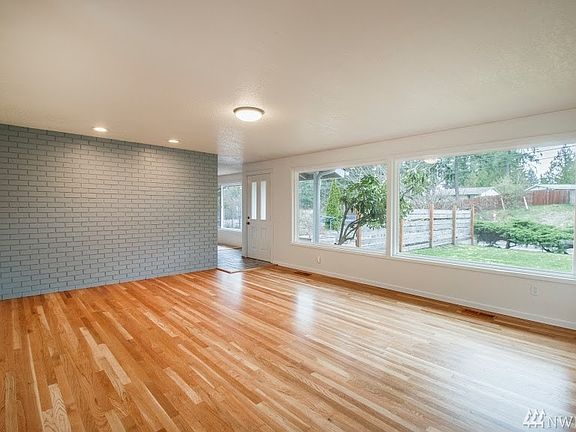Formal living room, amazing original Hardwood floors, tons of natural light coming in the front windows.