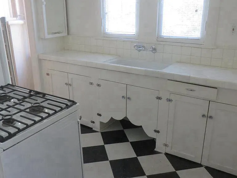 Kitchen with newer Maytag refrigerator and range