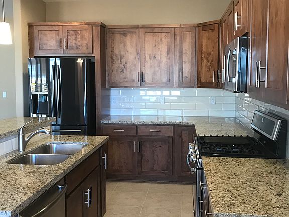 Kitchen with island. Refrigerator included.