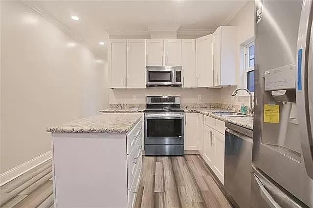 Full kitchen with stainless steel appliances