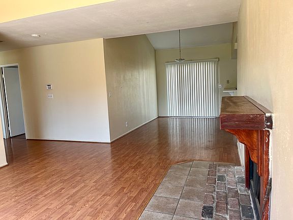 Living Room connecting to Dining area with sliding glass door to back patio