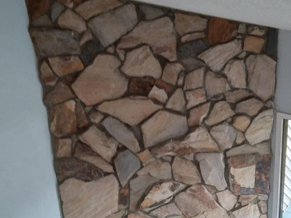 Floor-to-ceiling fireplace with gas logs