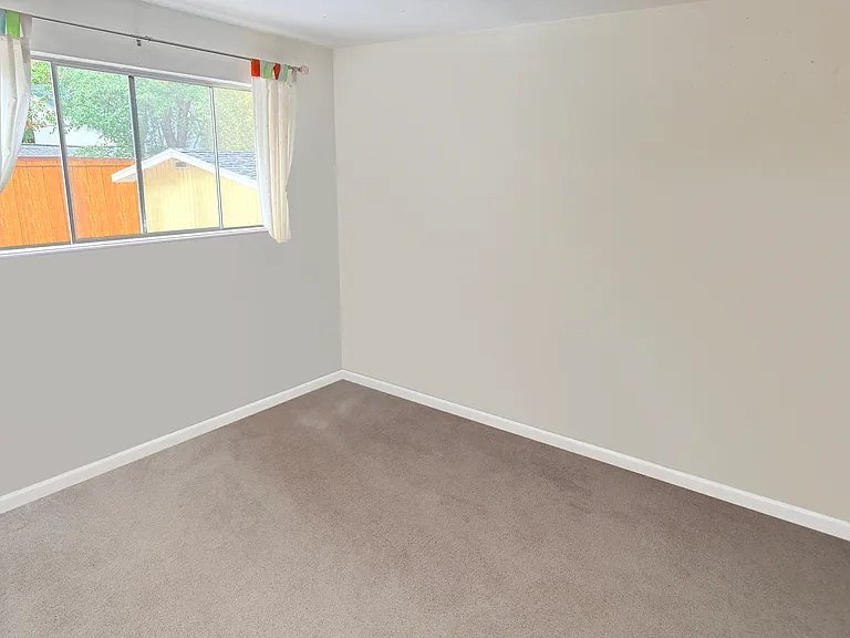 Downstairs bedroom, there's another upstairs bedroom a similar size. Both have medium closets.