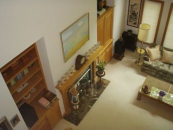 Overview of living room from the upstairs, built-ins.